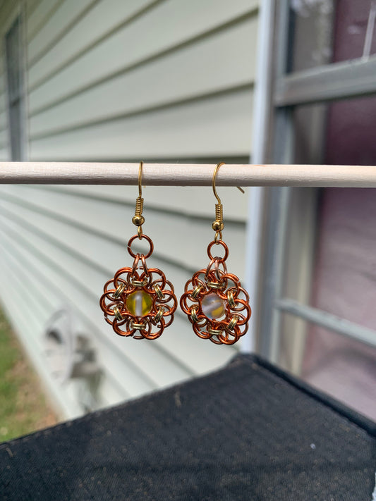 Golden Daisy made with a frosted bead in the center helping to pull out the amazing color of these rings.  A fantastic addition to anyone's wardrobe who loves orange and bright colors!